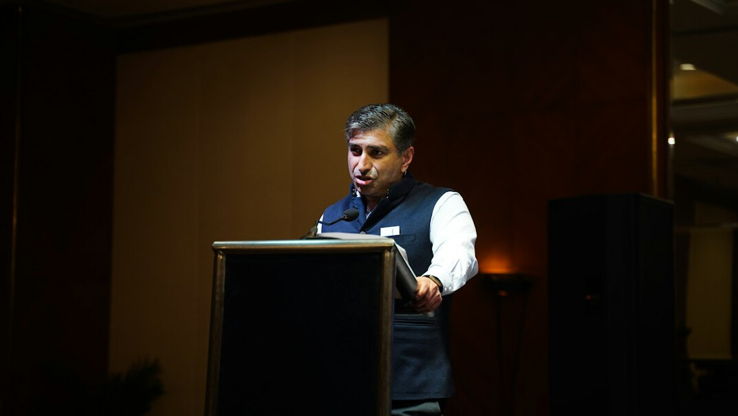 politician in suit at podium