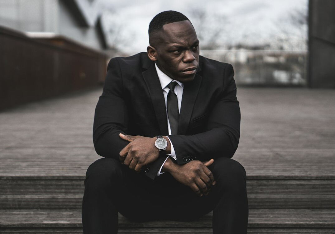 man in suit looking sad