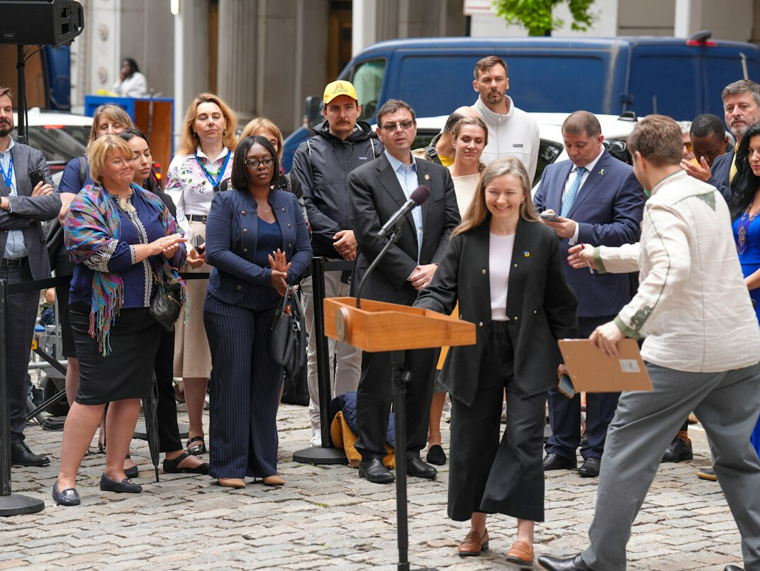 politician in suit at podium