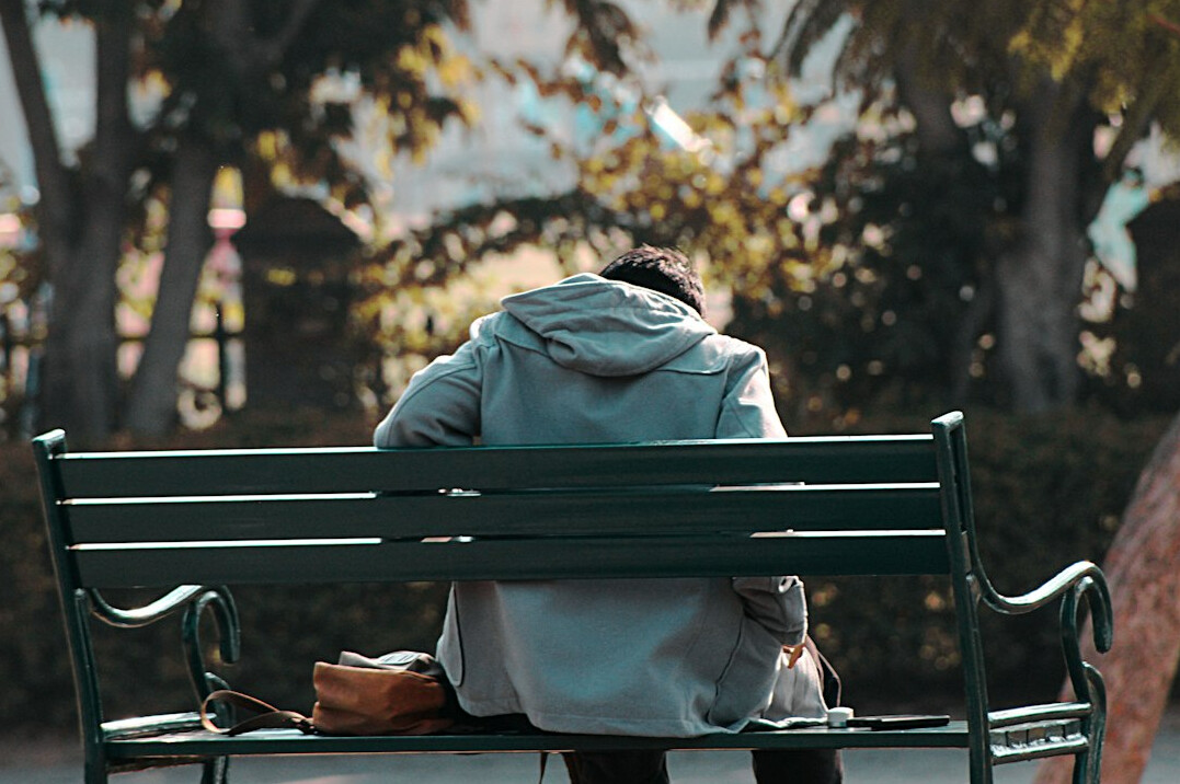 sad man sitting alone